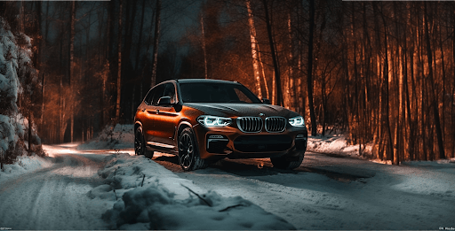 BMW X3 in a snowy forest, part of the visual narrative for ULTIM Marketing's Pirelli campaign