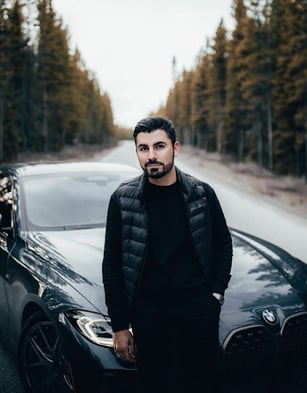 Alen Pallander posing with a BMW for the Pirelli campaign