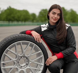 Toni Breidinger posing with the Pirelli P Zero tire on the track